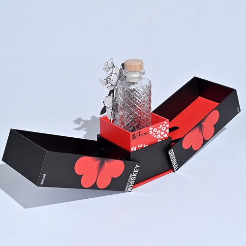 A lifting whiskey box-open view from left